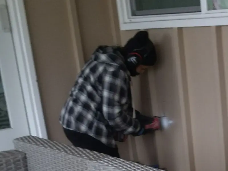 Professional electrician installing an exterior outlet in Brandywine